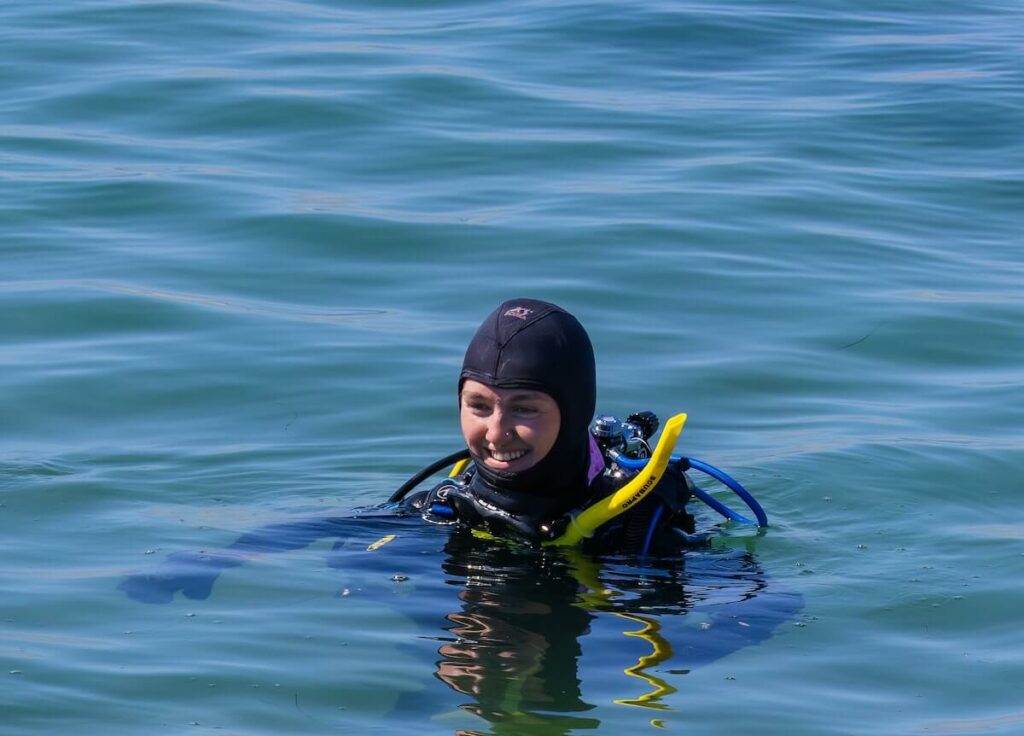scuba diver girl wearing a hood